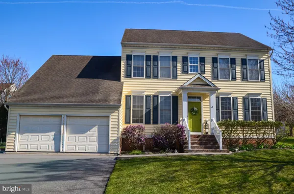 a house that has a big yard in front of it
