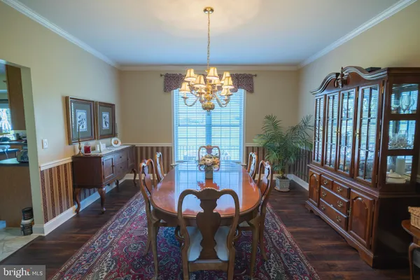 a bedroom with furniture and a wooden floor
