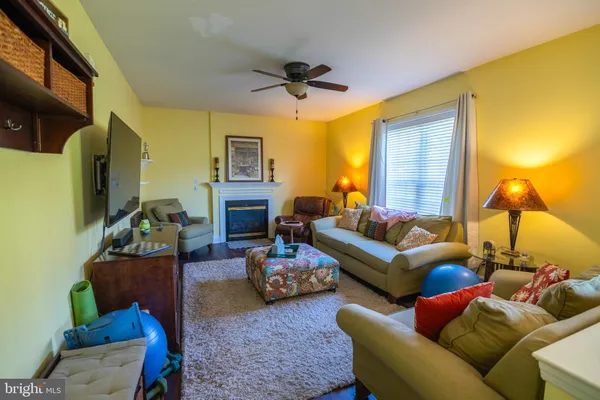 a bedroom with a bed and a lamp on the dresser