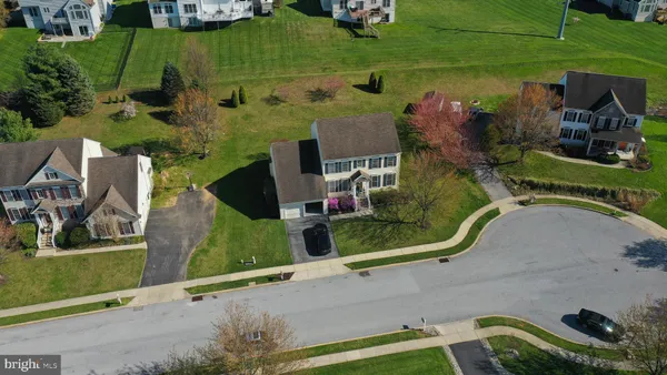 a aerial view of a house with a garden and sitting area