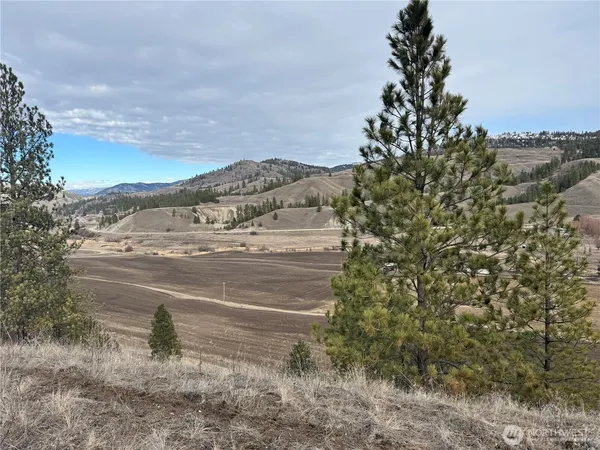 a view of a city street with a building