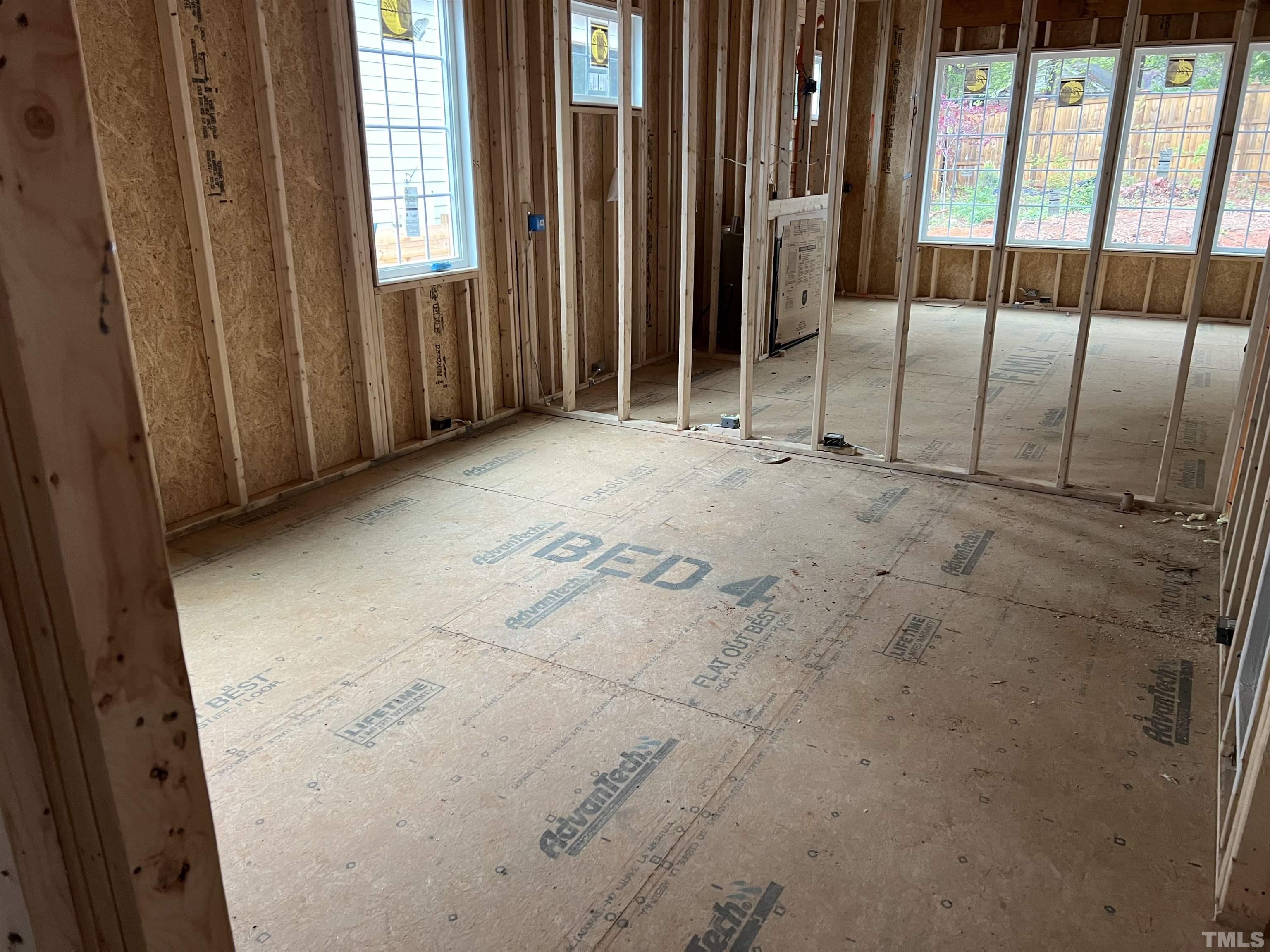 6309 Stephens Ridge Raleigh, NC 27615 - Photo 6 of 14 a view of an empty room with floor to ceiling window