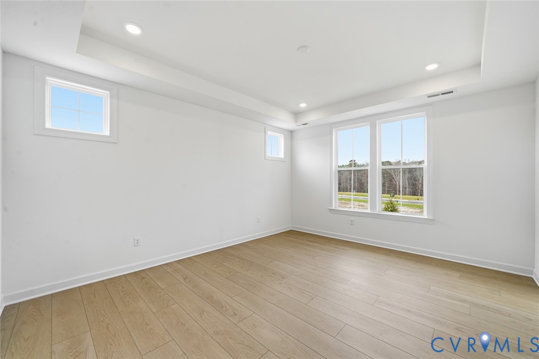 19025 Palisades Ridge Moseley, VA 23120 - Photo 11 of 41 wooden floor in an empty room with a window