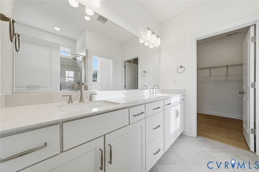 19025 Palisades Ridge Moseley, VA 23120 - Photo 13 of 41 a bathroom with a granite countertop sink mirror and double
