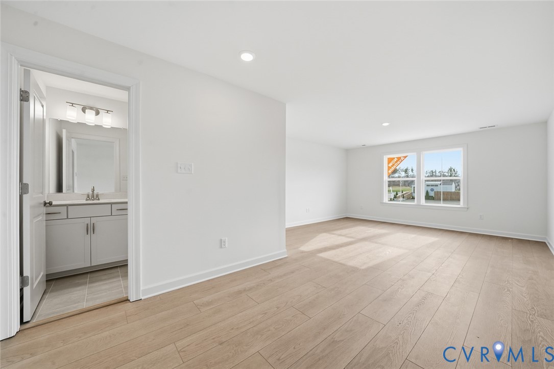 19025 Palisades Ridge Moseley, VA 23120 - Photo 18 of 41 an empty room with a bathroom and a sink