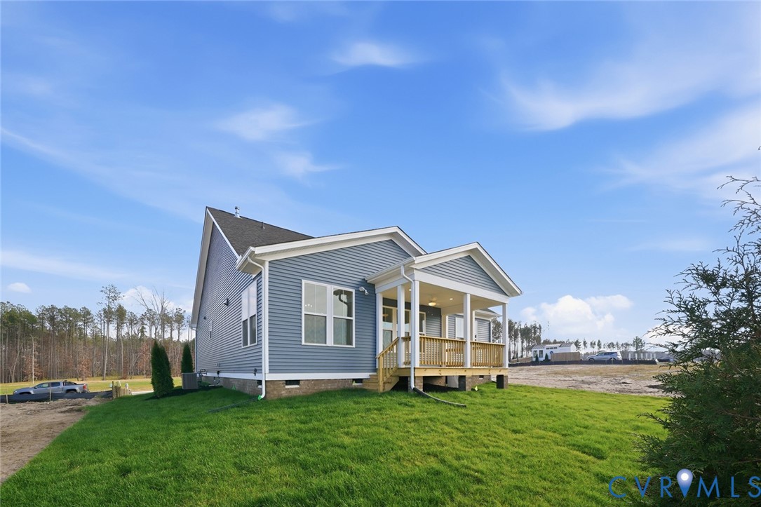 19025 Palisades Ridge Moseley, VA 23120 - Photo 22 of 41 a view of a house with a yard and deck
