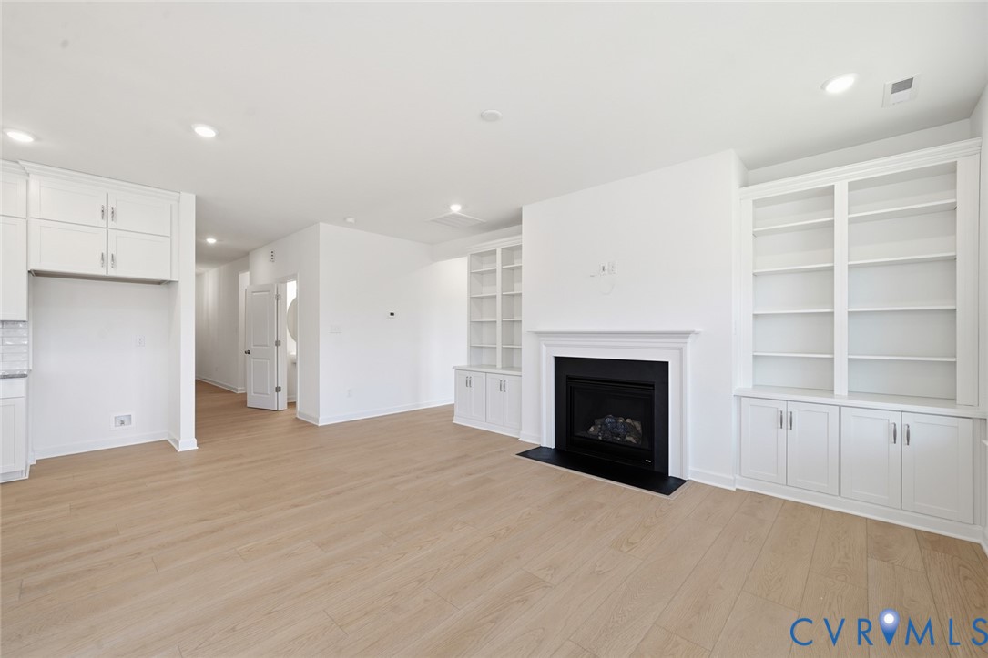 19025 Palisades Ridge Moseley, VA 23120 - Photo 4 of 41 a view of an empty room with a fireplace