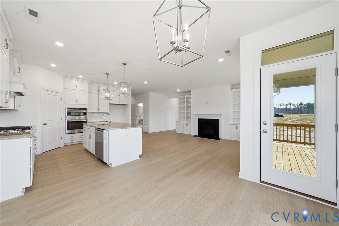 19025 Palisades Ridge Moseley, VA 23120 - Photo 6 of 41 a view of kitchen with furniture and wooden floor