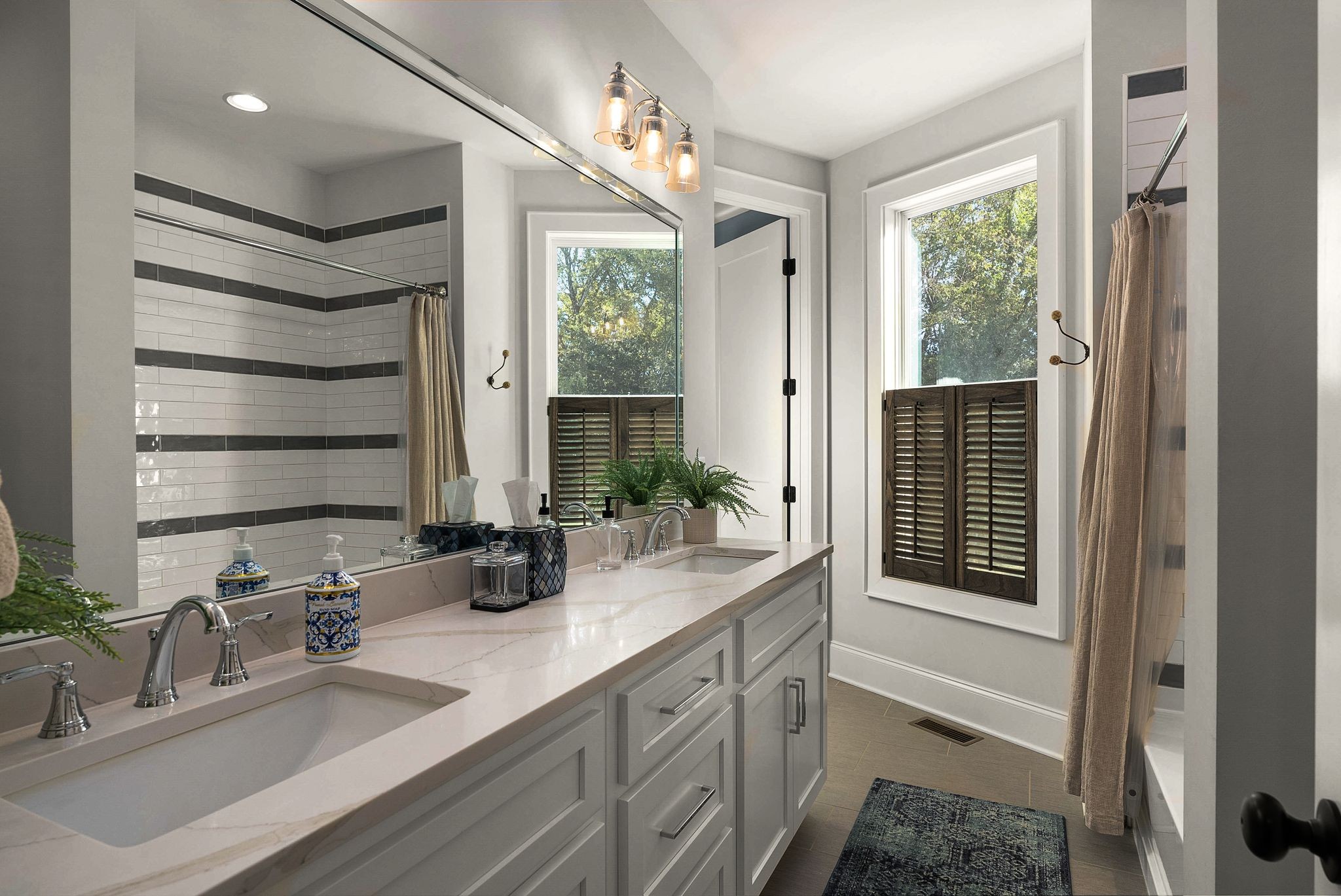1780 Berea Church Road Lebanon, TN 37087 - Photo 34 of 62 a bathroom with double vanity sink a mirror and a bathtub