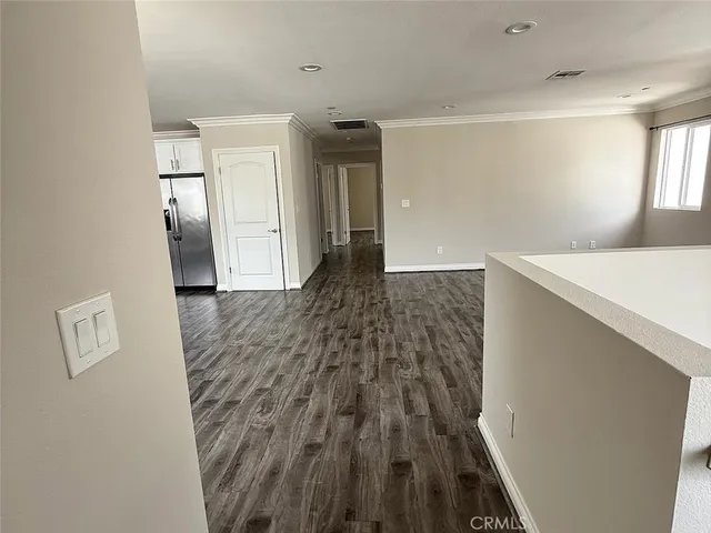 a view of hallway with wooden floor