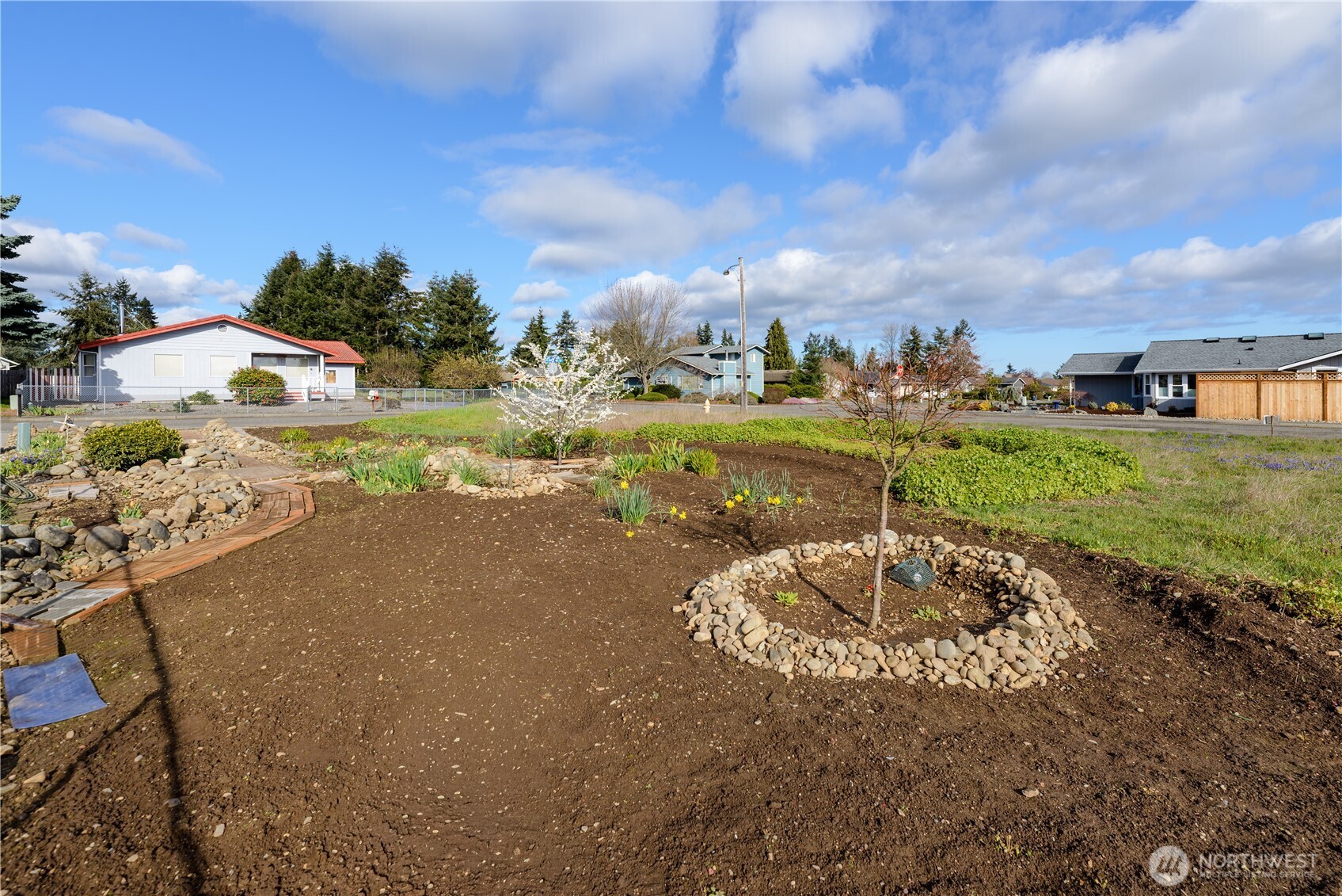 9999 North Honeycomb Circle Sequim, WA 98382 - Photo 11 of 12 a view of a lake with a big yard