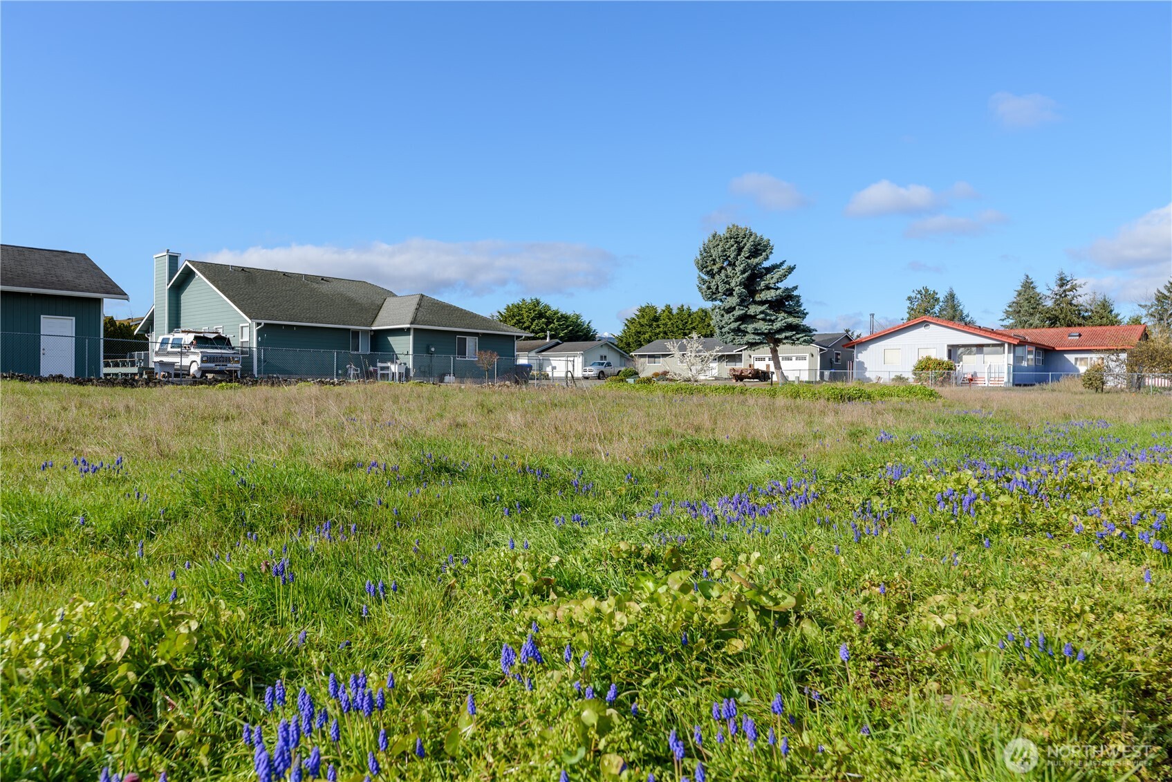 9999 North Honeycomb Circle Sequim, WA 98382 - Photo 6 of 12 a view of a house with a yard and plants