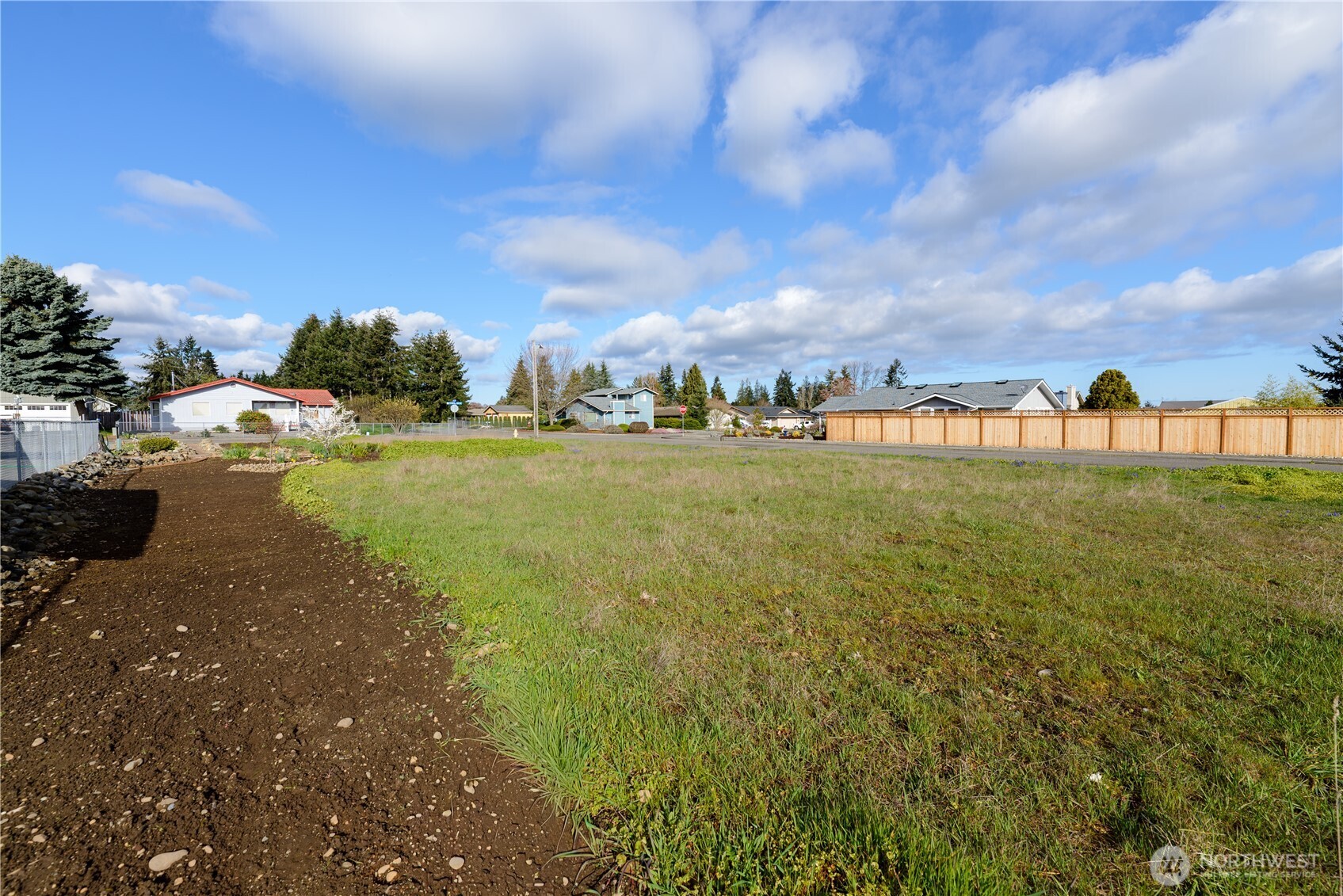 9999 North Honeycomb Circle Sequim, WA 98382 - Photo 7 of 12 a view of a lake with houses in the back