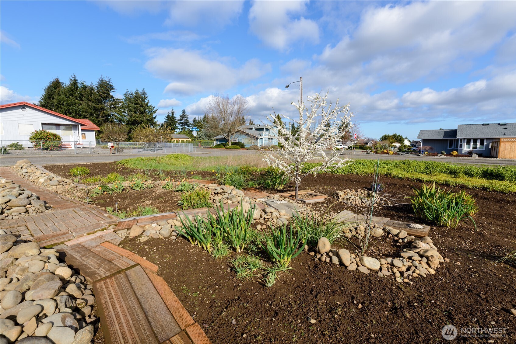 9999 North Honeycomb Circle Sequim, WA 98382 - Photo 10 of 12 a view of a lake with a big yard