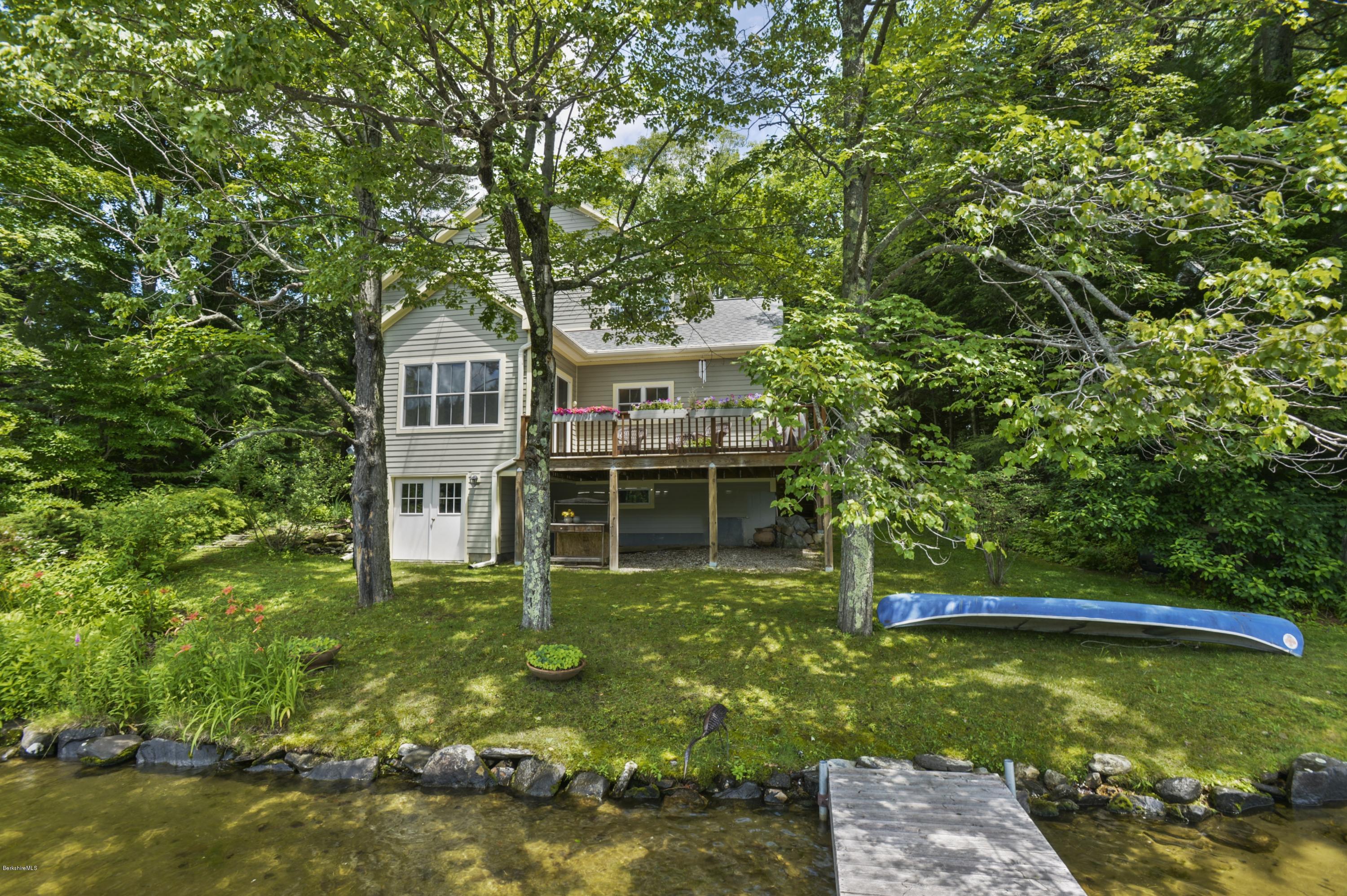 24 Point Road Monterey, MA 01245 - Photo 2 of 17 a front view of a house with a yard