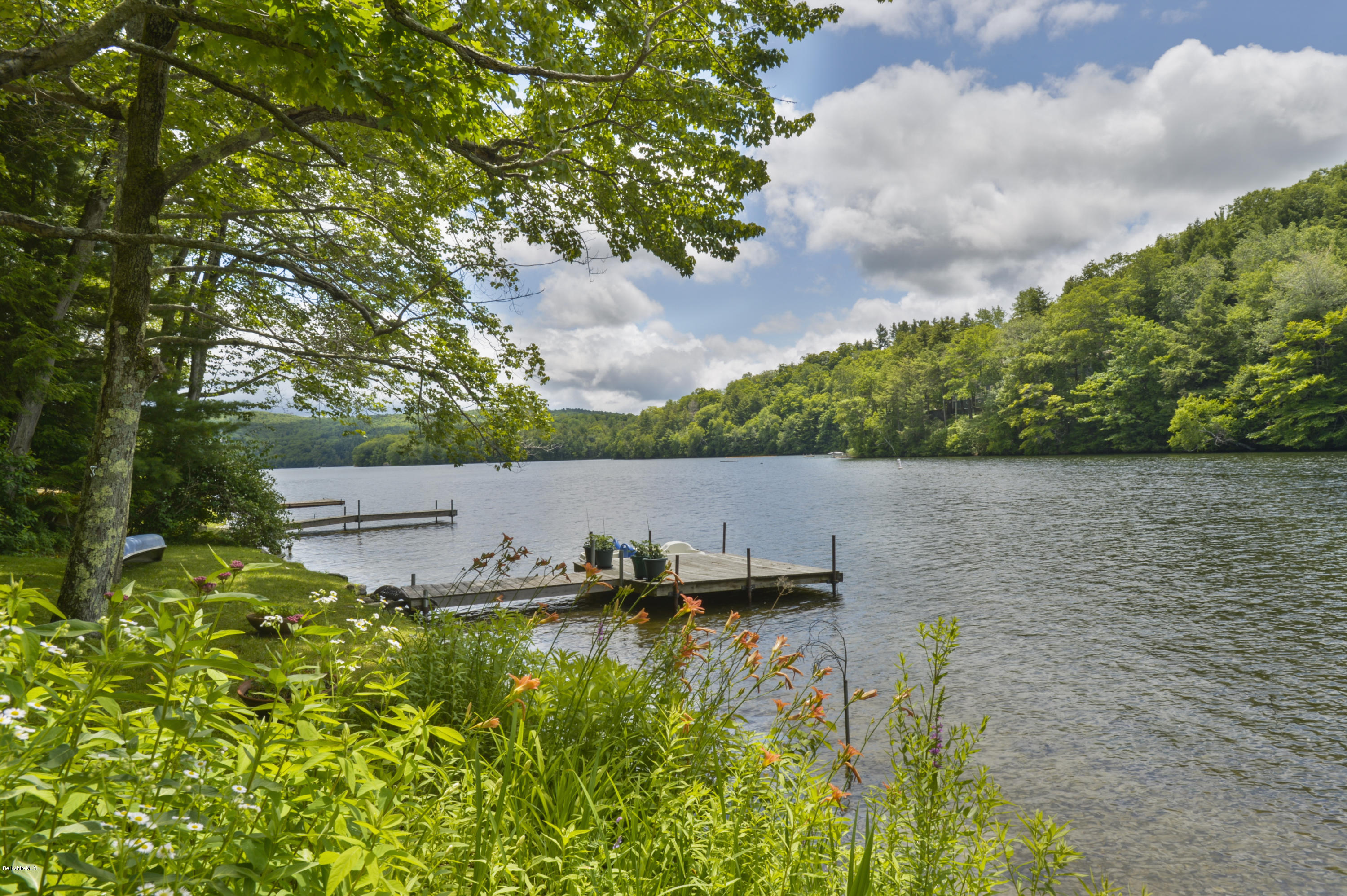 24 Point Road Monterey, MA 01245 - Photo 3 of 17 a view of a lake with houses in the back