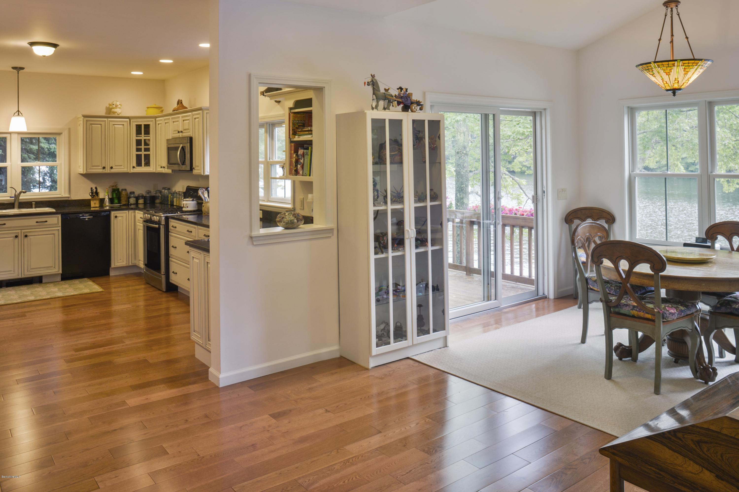 24 Point Road Monterey, MA 01245 - Photo 6 of 17 a view of a dining room with furniture window and wooden floor