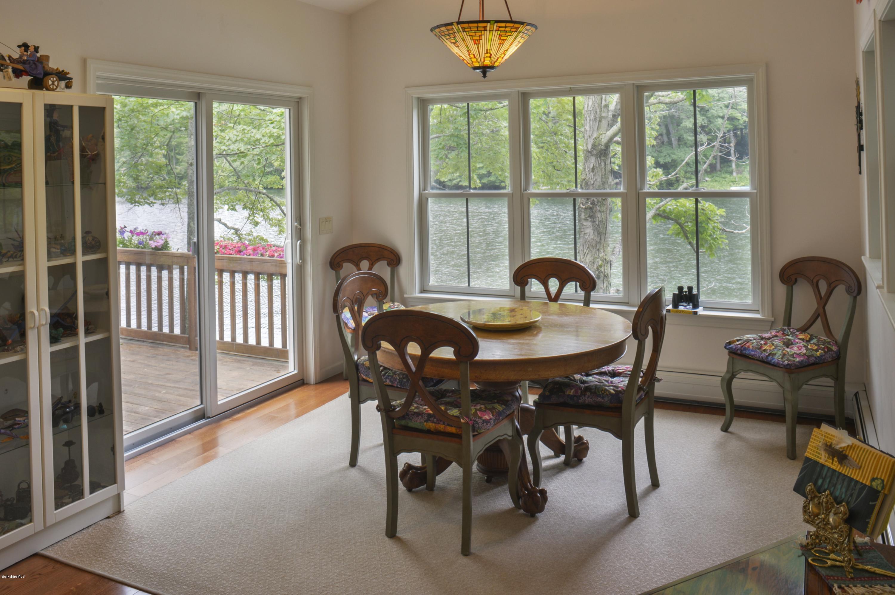 24 Point Road Monterey, MA 01245 - Photo 7 of 17 a view of a dining room and livingroom with furniture window and outside view