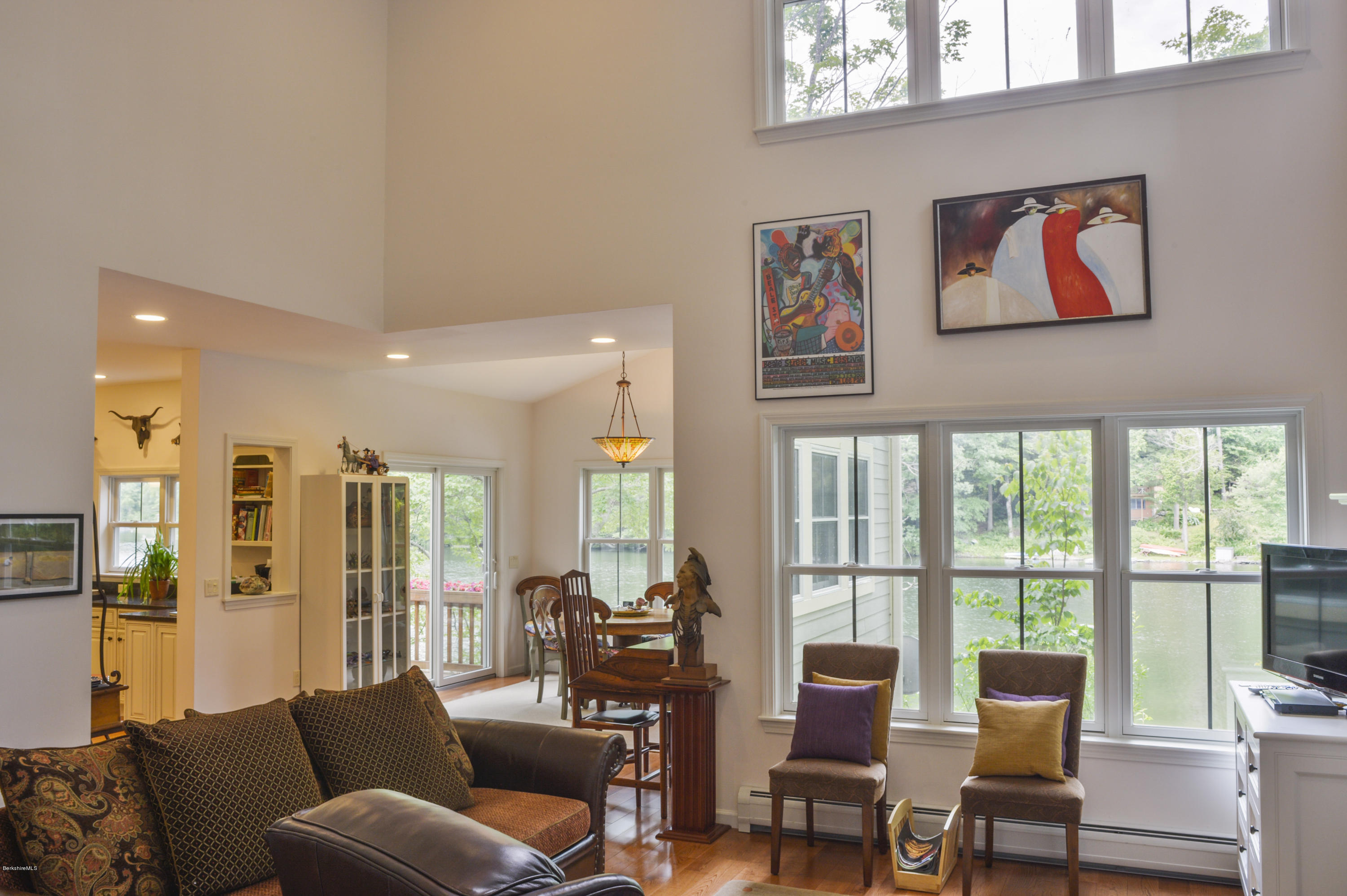 24 Point Road Monterey, MA 01245 - Photo 9 of 17 a living room with furniture large windows and wooden floor