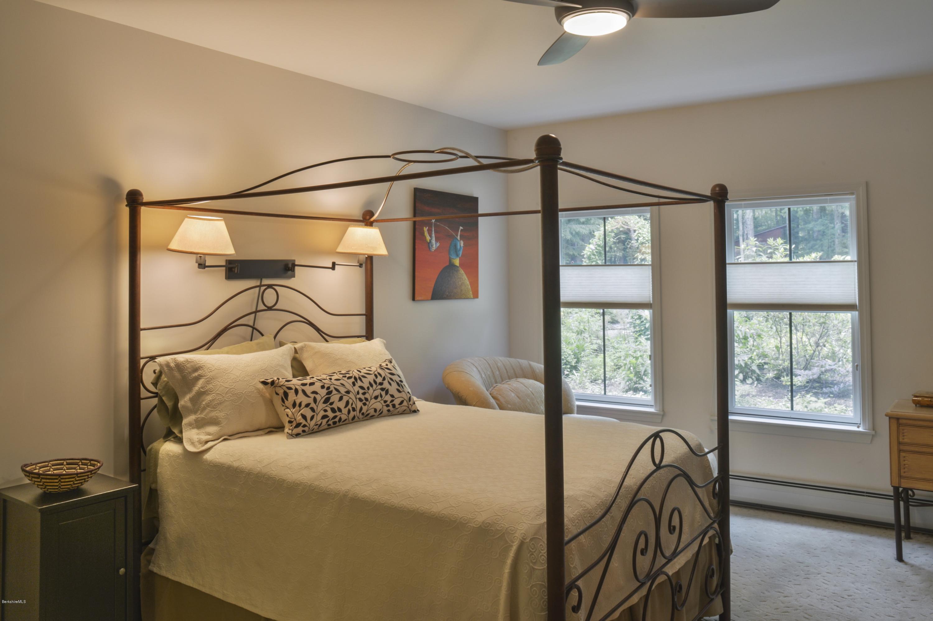 24 Point Road Monterey, MA 01245 - Photo 10 of 17 a bedroom with a bed next to a window