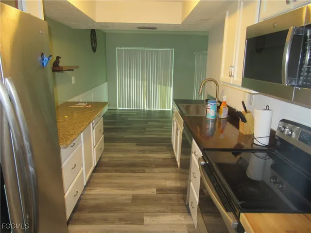 a bathroom with a sink a mirror and shower