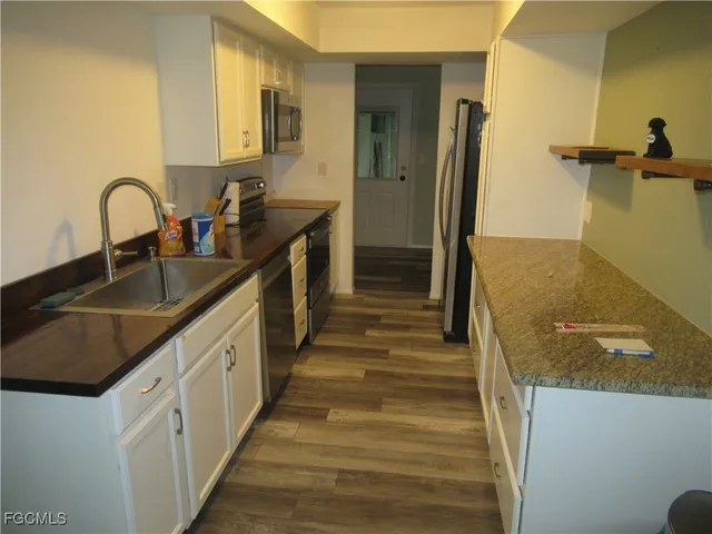 a bathroom with sink a vanity and a mirror
