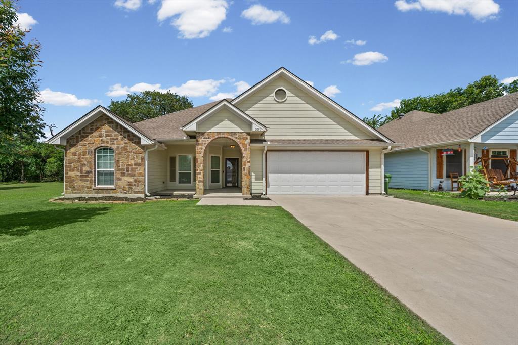 229 Firefly Drive Springtown, TX 76082 - Photo 1 of 33 Single-story residence featuring a stone and siding exterior
