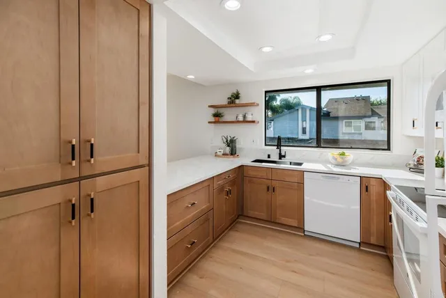 a spacious bathroom with a double vanity sink a mirror and a bathtub