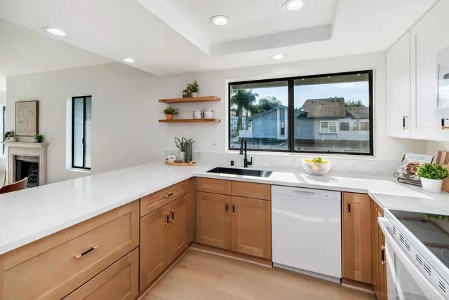 a kitchen with a sink and cabinets