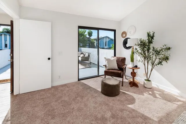 a workspace with furniture and a potted plant