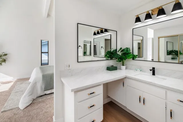 a bathroom with a sink and a mirror