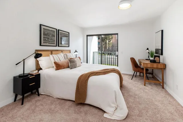 a bedroom with a bed and a couch