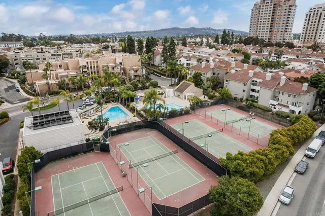 an aerial view of residential houses with outdoor space