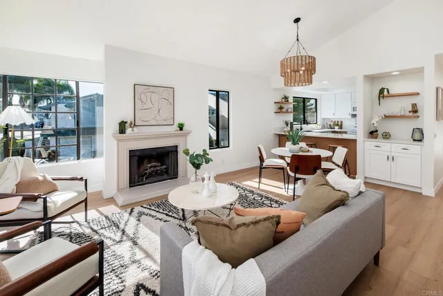 a living room with furniture a window and a fireplace