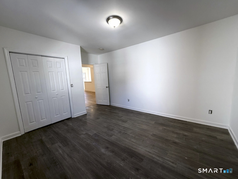 30 Dora Street Stamford, CT 06902 - Photo 11 of 18 wooden floor in an empty room