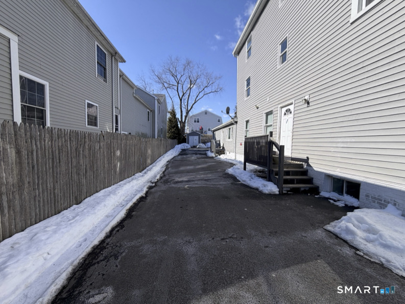 30 Dora Street Stamford, CT 06902 - Photo 18 of 18 a view of a house with a yard