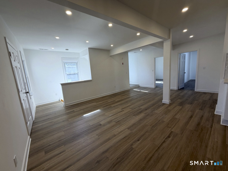 30 Dora Street Stamford, CT 06902 - Photo 3 of 18 a view of empty room with wooden floor