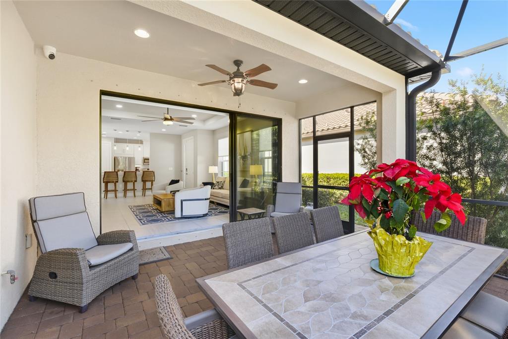 5804 Semolino Street Nokomis, FL 34275 - Photo 25 of 53 a living room with furniture and flowers