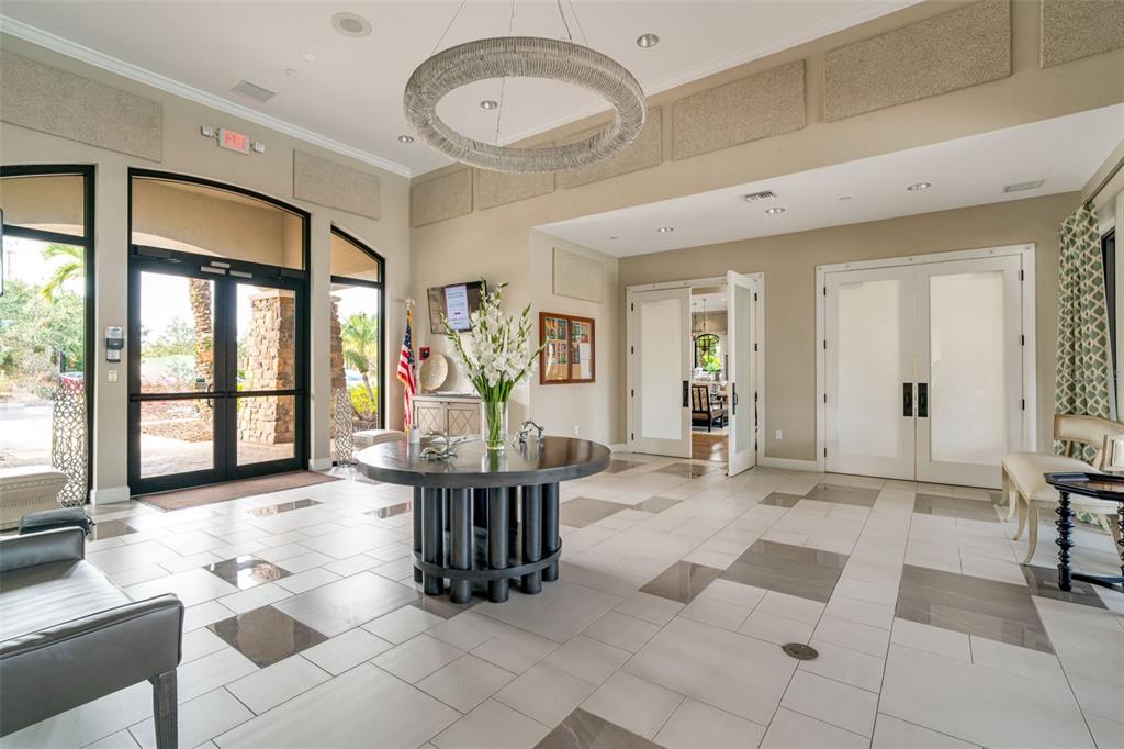 5804 Semolino Street Nokomis, FL 34275 - Photo 42 of 53 a living room with furniture a flat screen tv and a large window