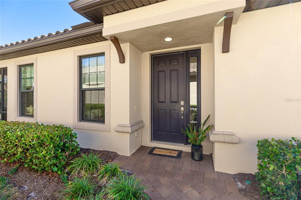 5804 Semolino Street Nokomis, FL 34275 - Photo 5 of 53 a front view of a house with a yard