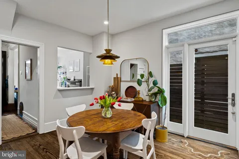 a backyard of a house with chairs