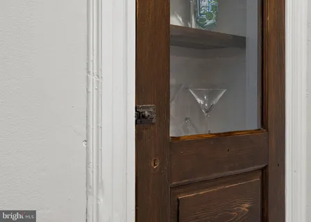 a bedroom with a bed and a television