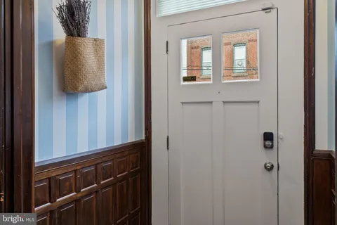 a view of a workspace with furniture and a fireplace