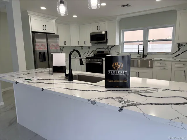 a kitchen with a sink and cabinets