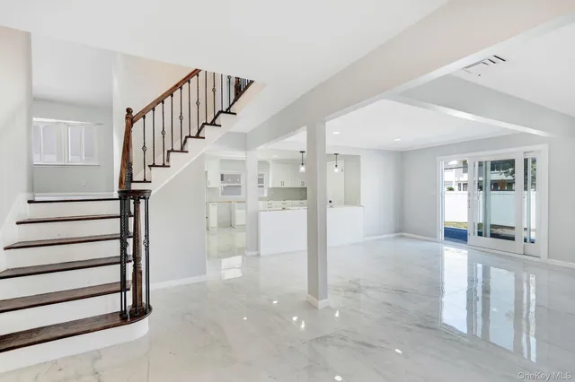 a view of a hallway with staircase