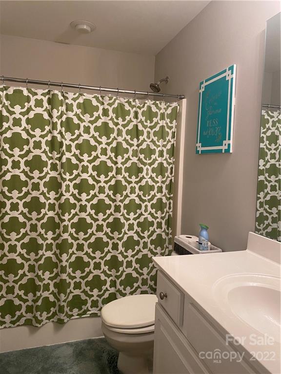 514 Bent Leaf Court, Unit 11 Fort Mill, SC 29708 - Photo 13 of 22 a bathroom with a toilet and a shower curtain