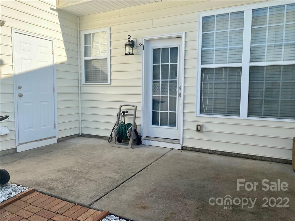514 Bent Leaf Court, Unit 11 Fort Mill, SC 29708 - Photo 19 of 22 a view of a house with a chair and a gate