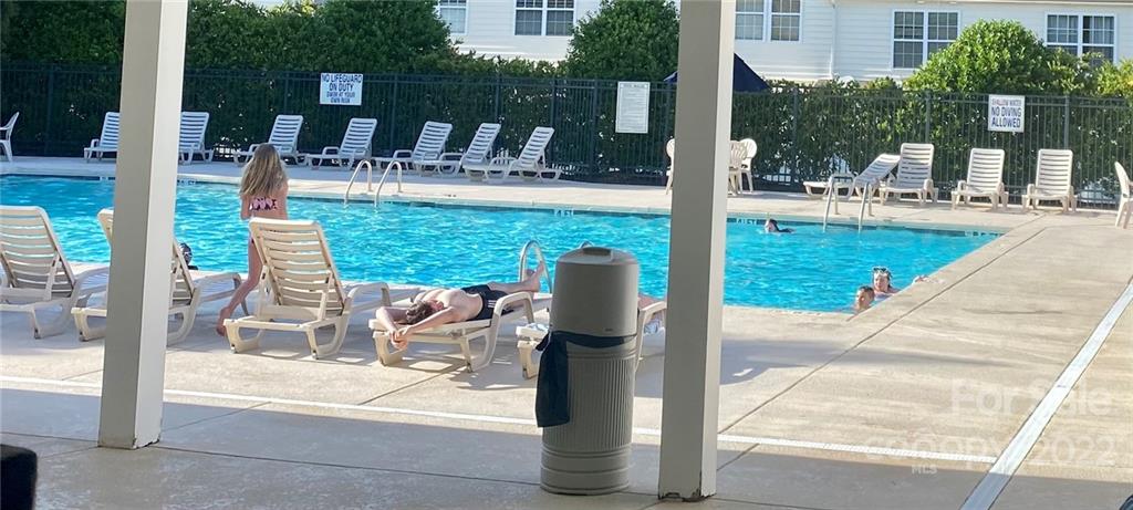 514 Bent Leaf Court, Unit 11 Fort Mill, SC 29708 - Photo 20 of 22 a view of a patio with a table chairs and a patio