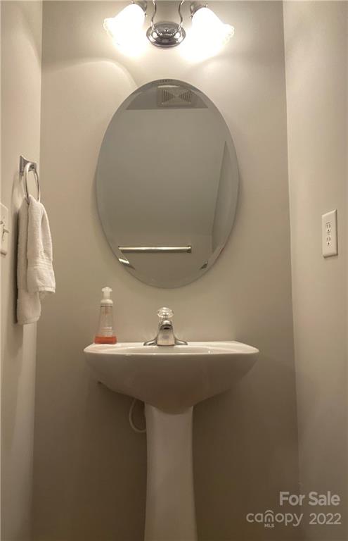 514 Bent Leaf Court, Unit 11 Fort Mill, SC 29708 - Photo 7 of 22 a bathroom with a sink a mirror and vanity