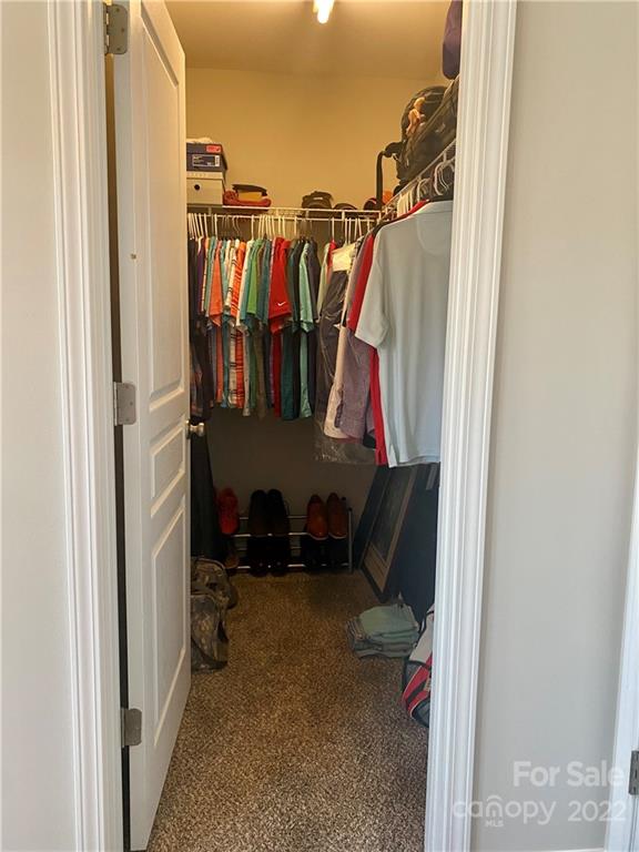 514 Bent Leaf Court, Unit 11 Fort Mill, SC 29708 - Photo 10 of 22 a view of walk in closet with clothes and shoes